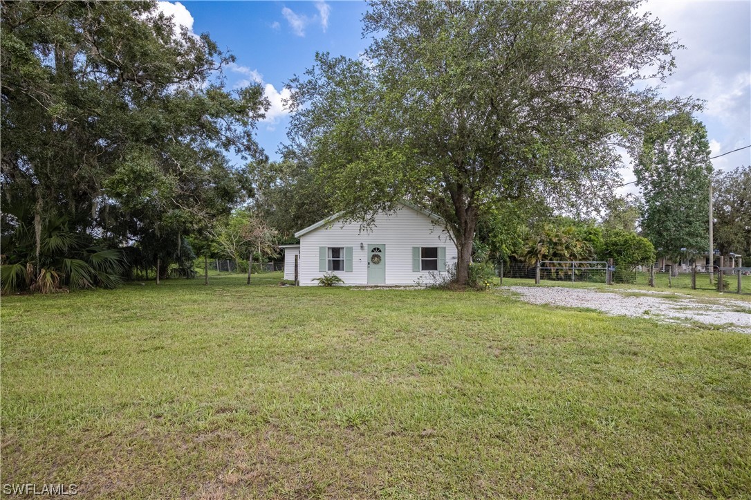 2701 Packinghouse Road Alva, FL 33920 - Photo 21 of 33 a view of a house with a backyard