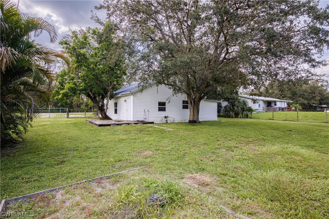 2701 Packinghouse Road Alva, FL 33920 - Photo 23 of 33 a house view with swimming pool in front of it