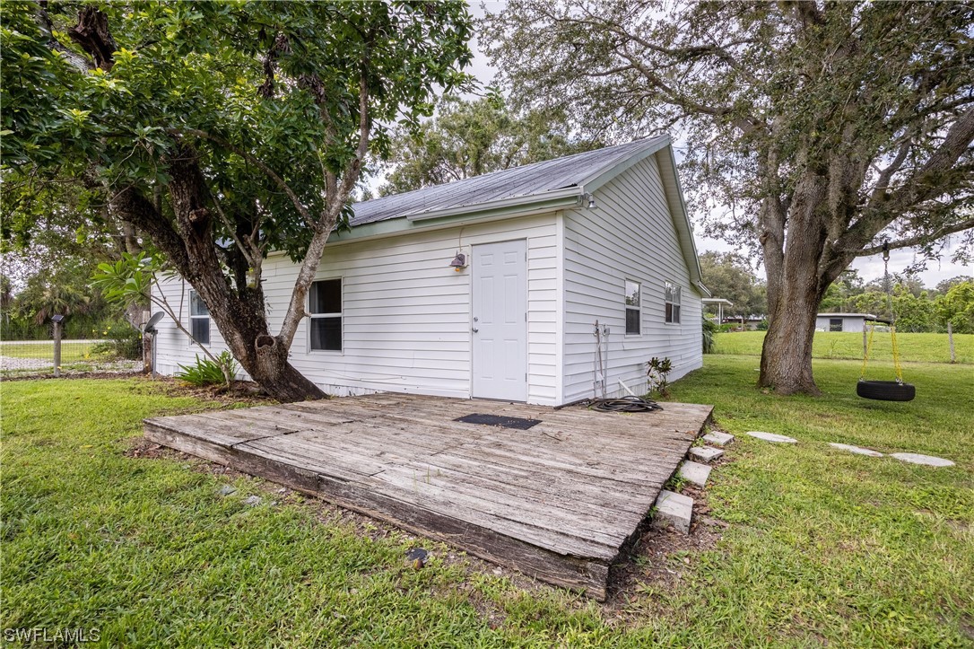 2701 Packinghouse Road Alva, FL 33920 - Photo 26 of 33 a view of a house with yard and tree s