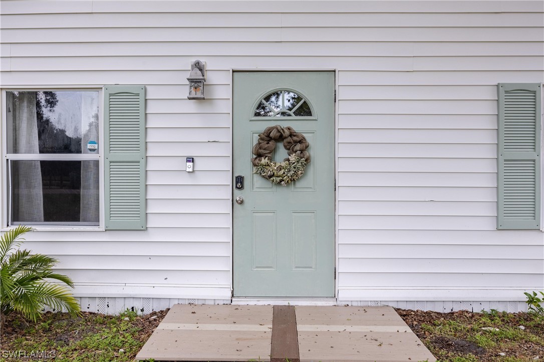 2701 Packinghouse Road Alva, FL 33920 - Photo 27 of 33 a view of a entryway door front of house