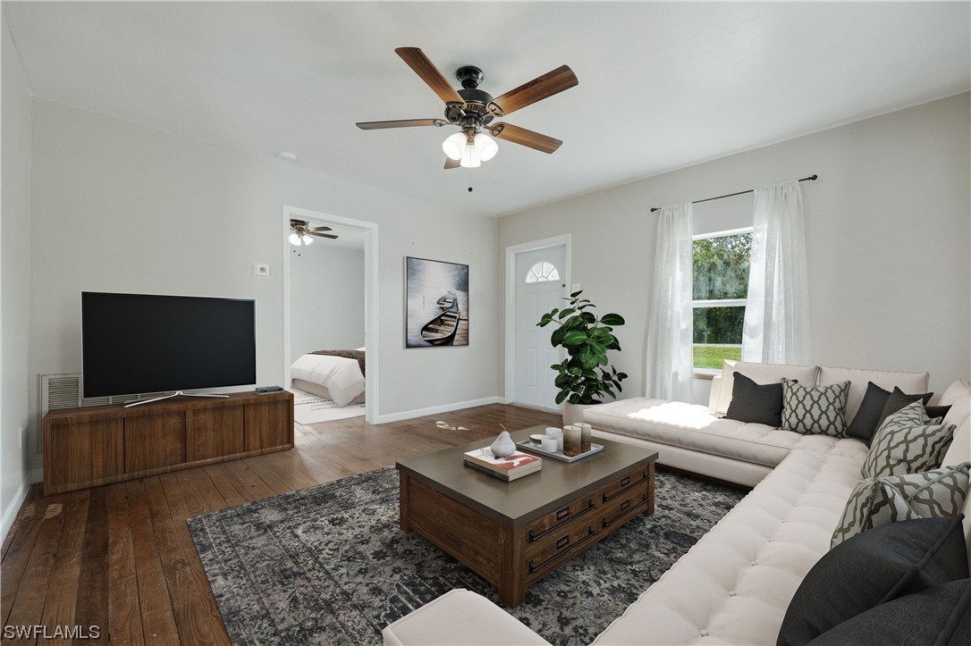2701 Packinghouse Road Alva, FL 33920 - Photo 4 of 33 a living room with furniture and a flat screen tv