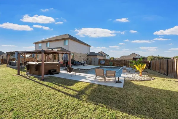 a view of a house with swimming pool and sitting area