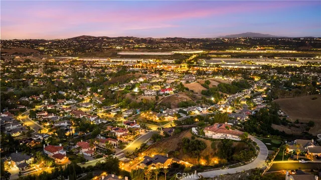 a large white kitchen with a large window