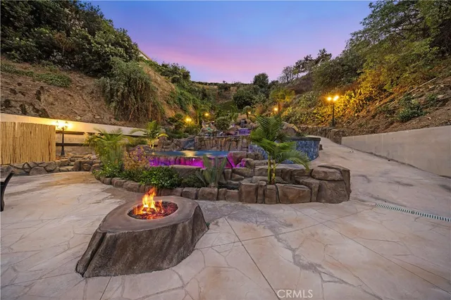 a view of a livingroom with furniture and a hallway