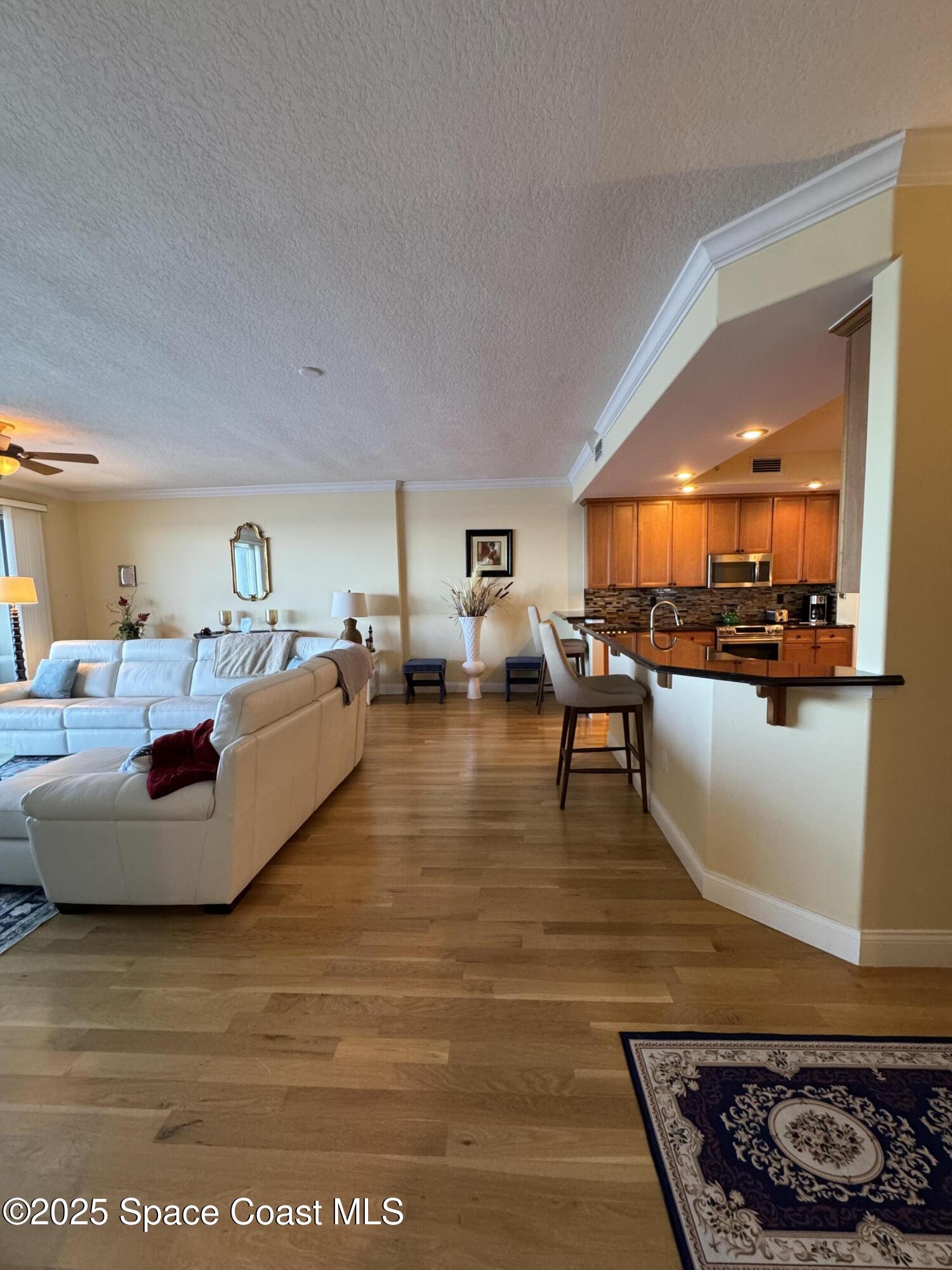 4955 Dixie Highway Northeast, Unit 502 Palm Bay, FL 32905 - Photo 14 of 51 a living room with furniture and a flat screen tv