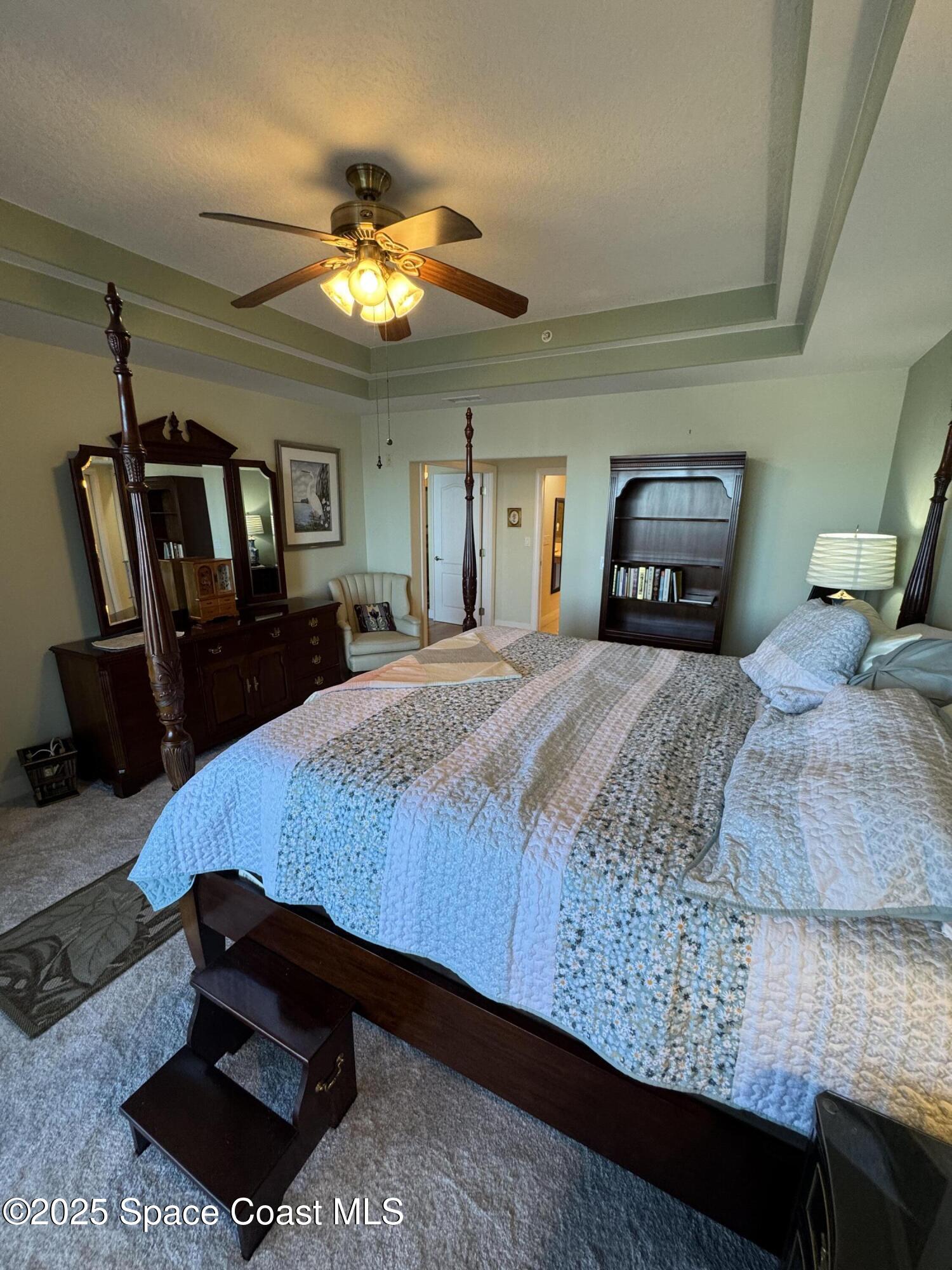 4955 Dixie Highway Northeast, Unit 502 Palm Bay, FL 32905 - Photo 26 of 51 a bedroom with a bed a dresser and window