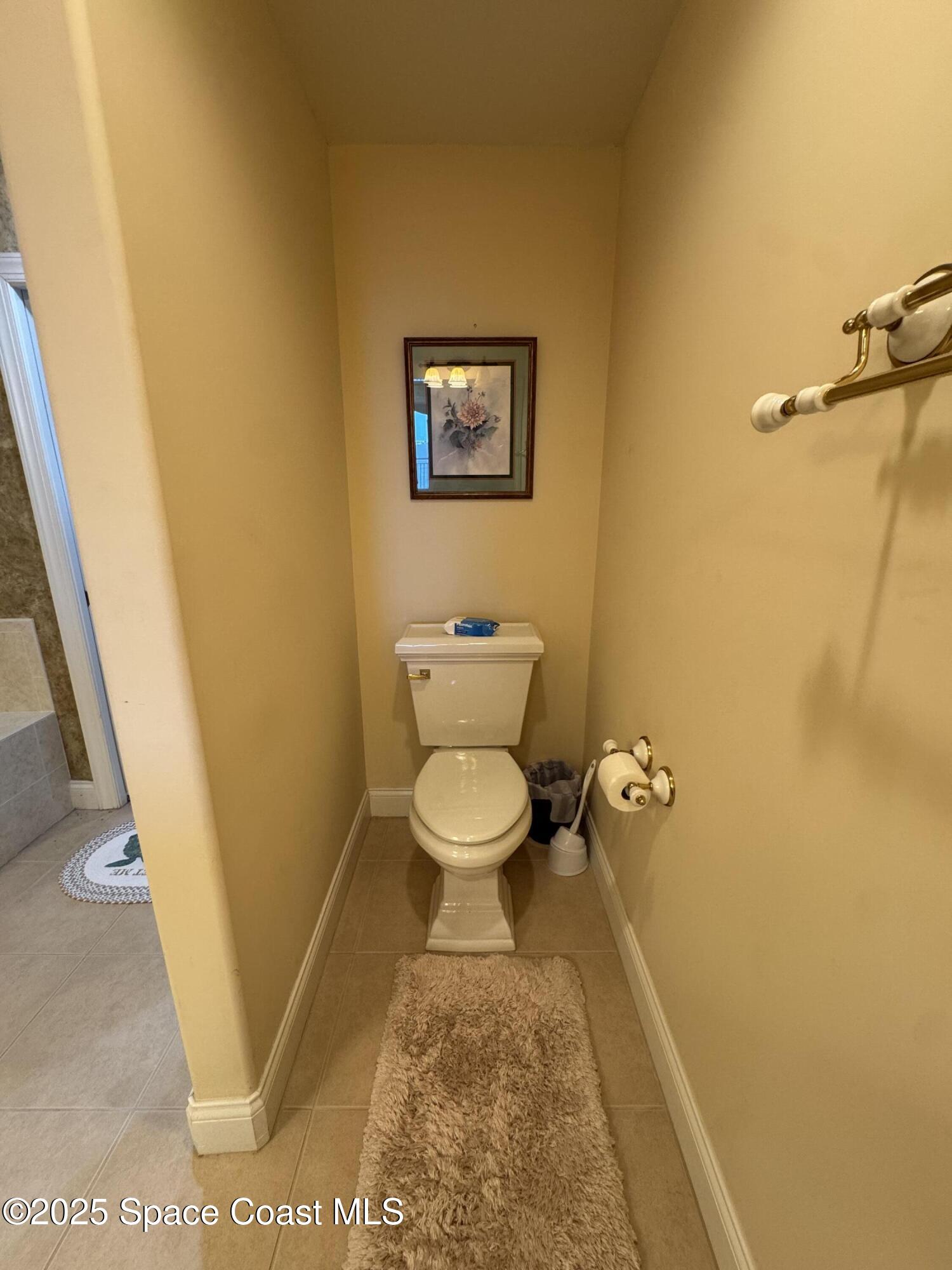 4955 Dixie Highway Northeast, Unit 502 Palm Bay, FL 32905 - Photo 28 of 51 a bathroom with a toilet and a tub