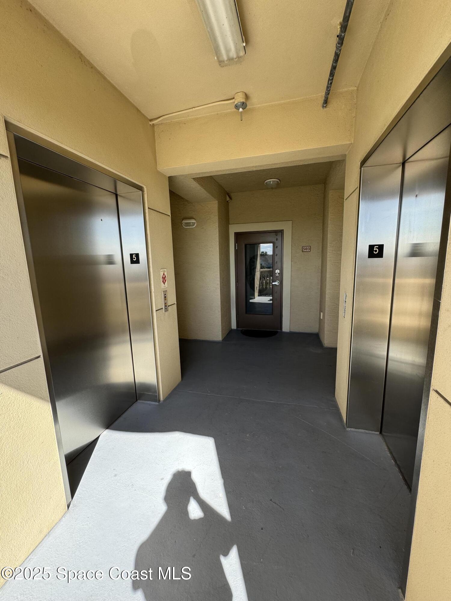 4955 Dixie Highway Northeast, Unit 502 Palm Bay, FL 32905 - Photo 3 of 51 a view of a hallway with entryway