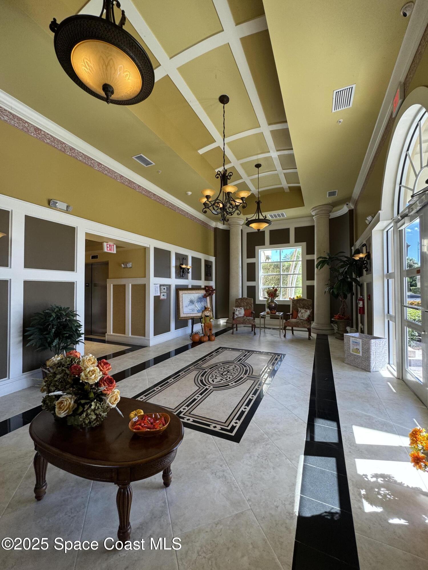 4955 Dixie Highway Northeast, Unit 502 Palm Bay, FL 32905 - Photo 40 of 51 a living room with furniture and a floor to ceiling window