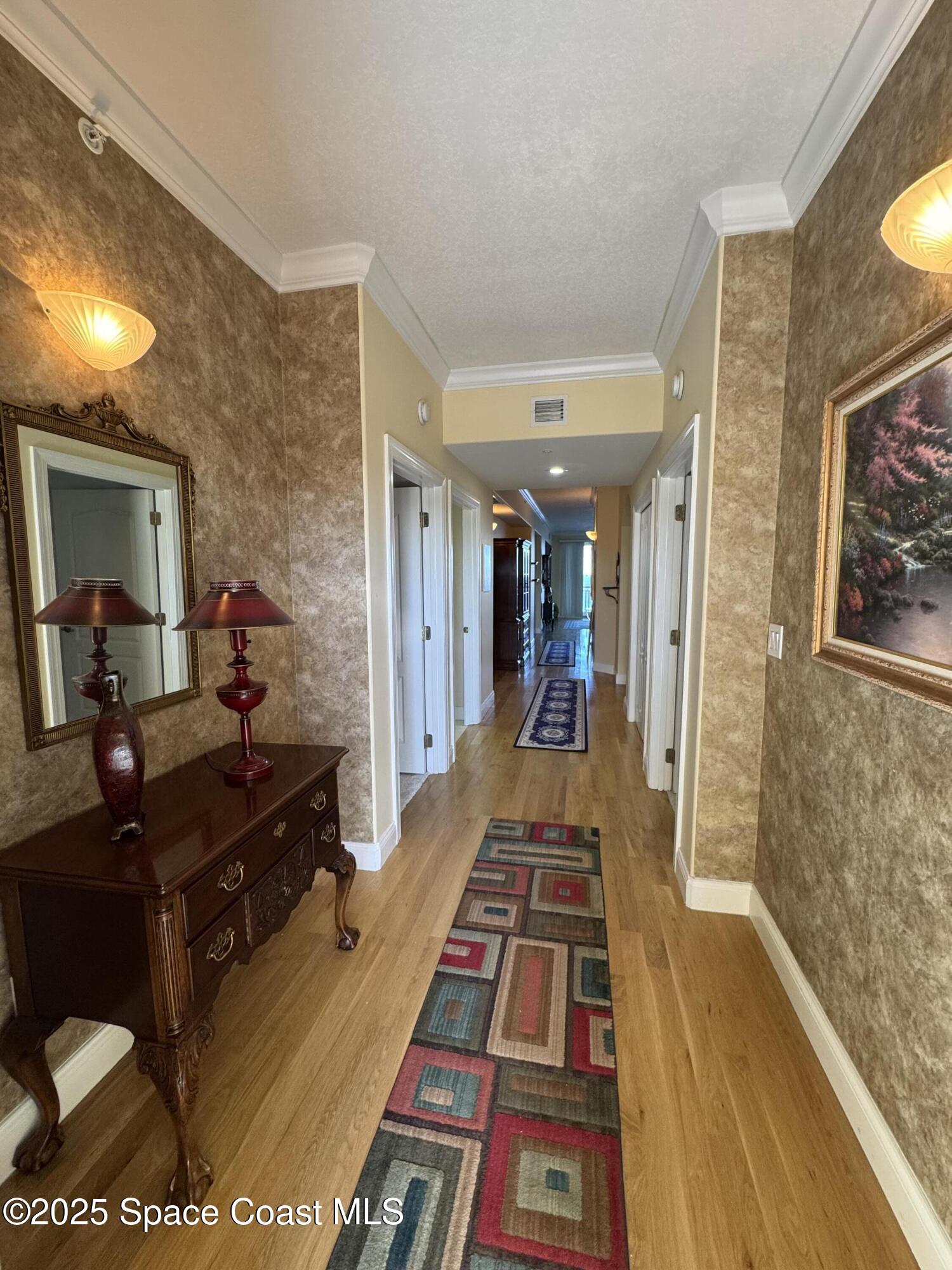 4955 Dixie Highway Northeast, Unit 502 Palm Bay, FL 32905 - Photo 4 of 51 a very nice looking room with a large mirror and a furniture