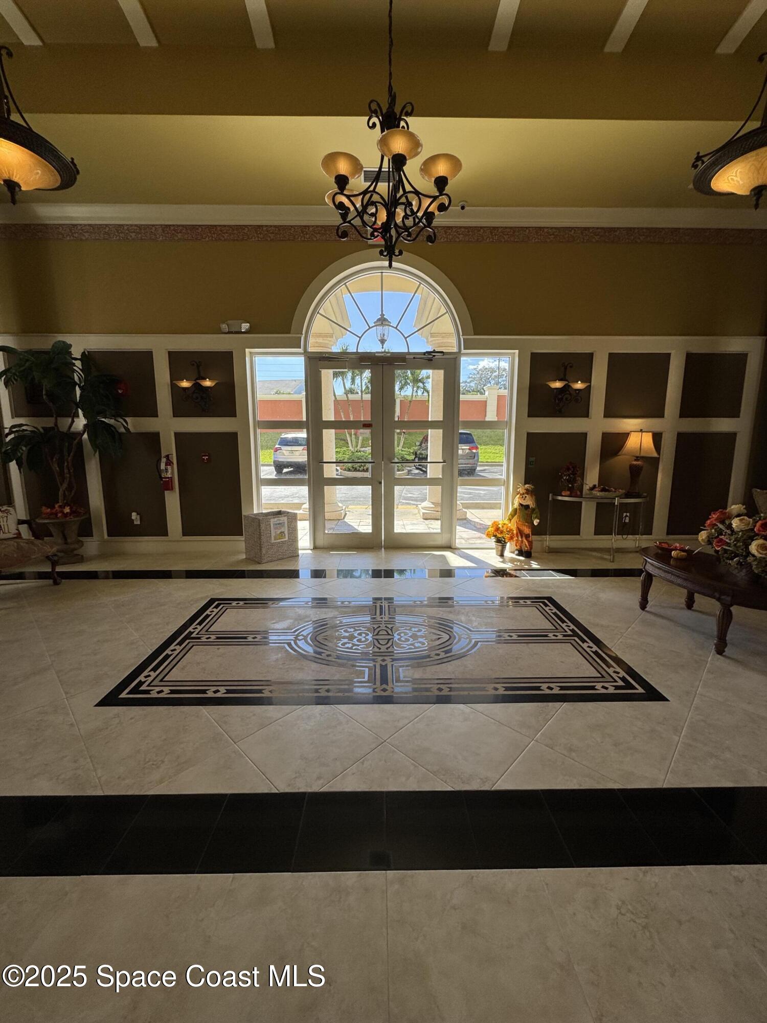 4955 Dixie Highway Northeast, Unit 502 Palm Bay, FL 32905 - Photo 41 of 51 a view of a hall with a couch