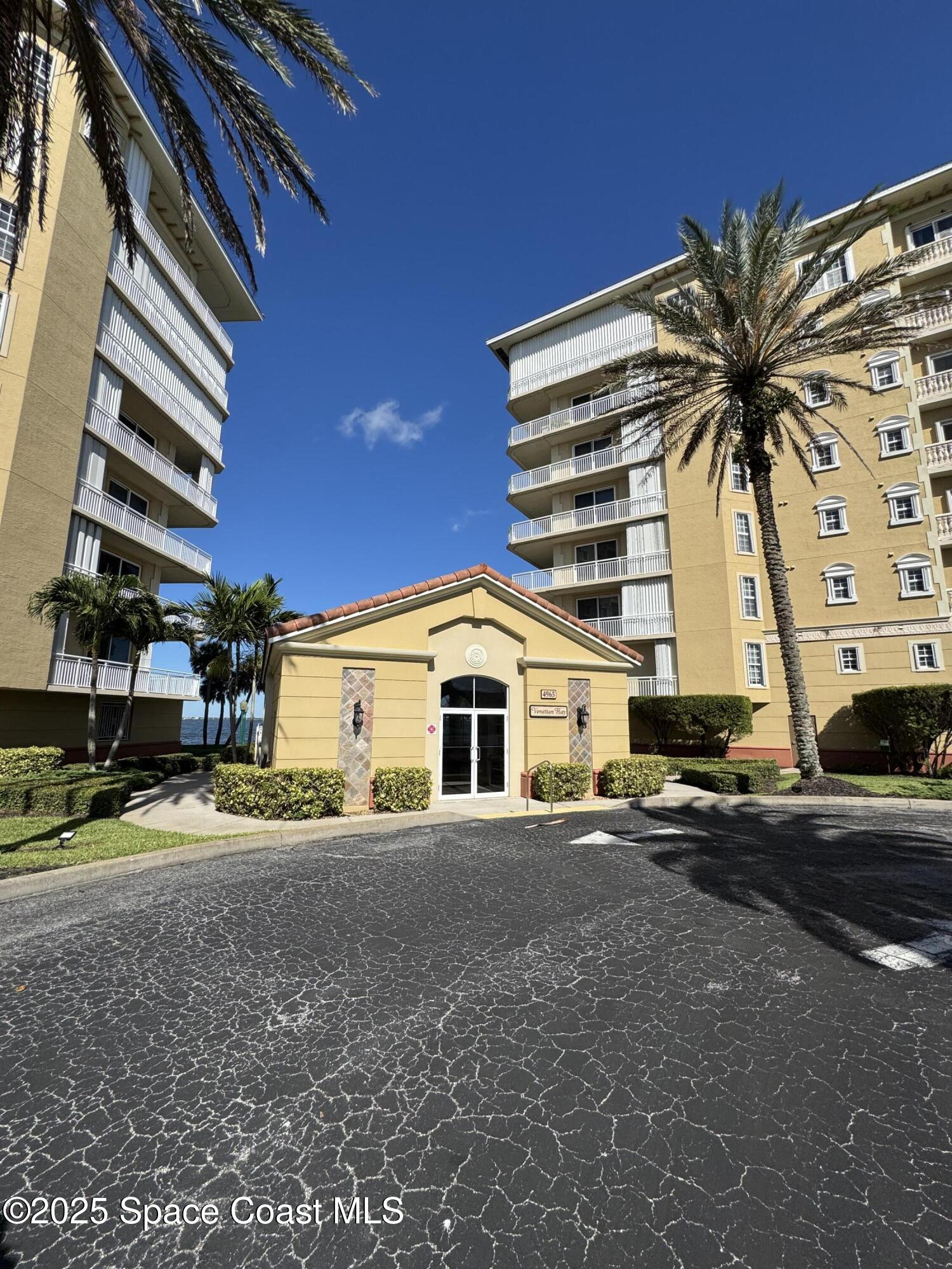 4955 Dixie Highway Northeast, Unit 502 Palm Bay, FL 32905 - Photo 43 of 51 a front view of a house with a yard