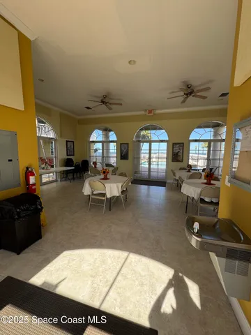 a living room with furniture a rug and a window