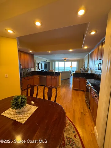 a kitchen with stainless steel appliances granite countertop a sink and cabinets