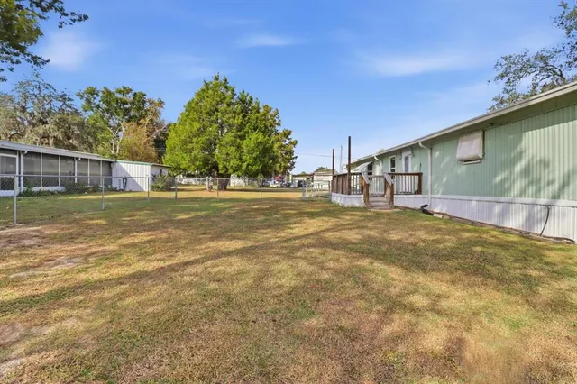 a view of a house with pool yard and roof