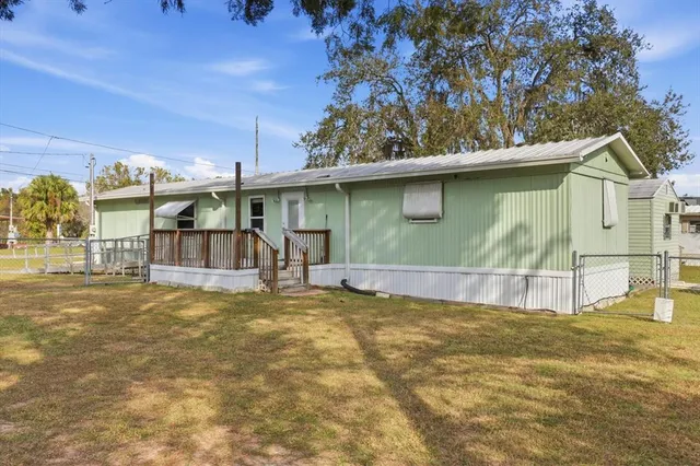 a view of a back yard of the house