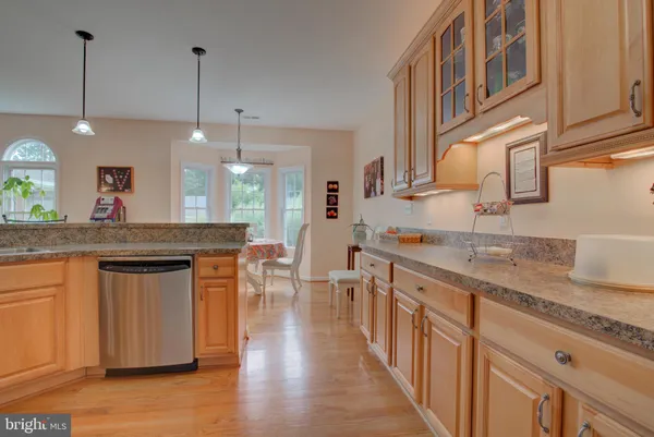 a kitchen with a refrigerator and a sink