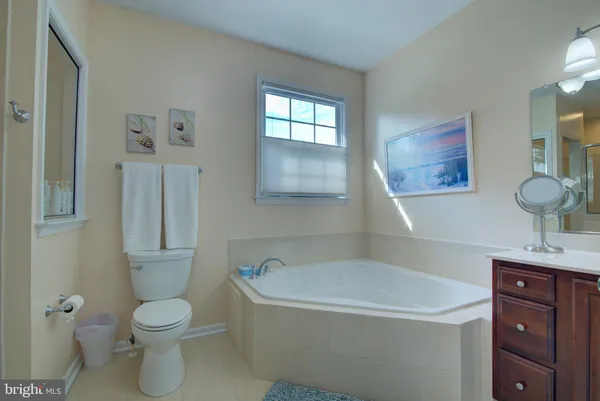 a bathroom with a toilet sink and shower