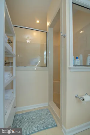 a bedroom with a bed a couch and dresser