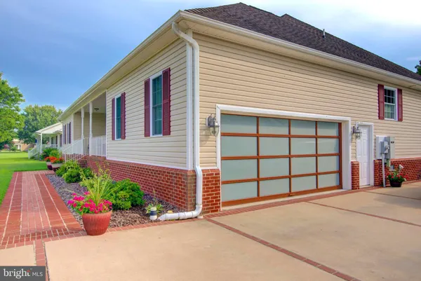 a view of balcony with furniture and garden