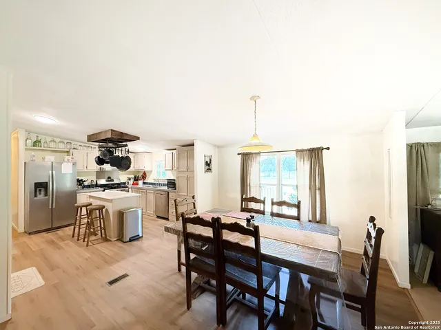 a view of a dining room with furniture window and outside view