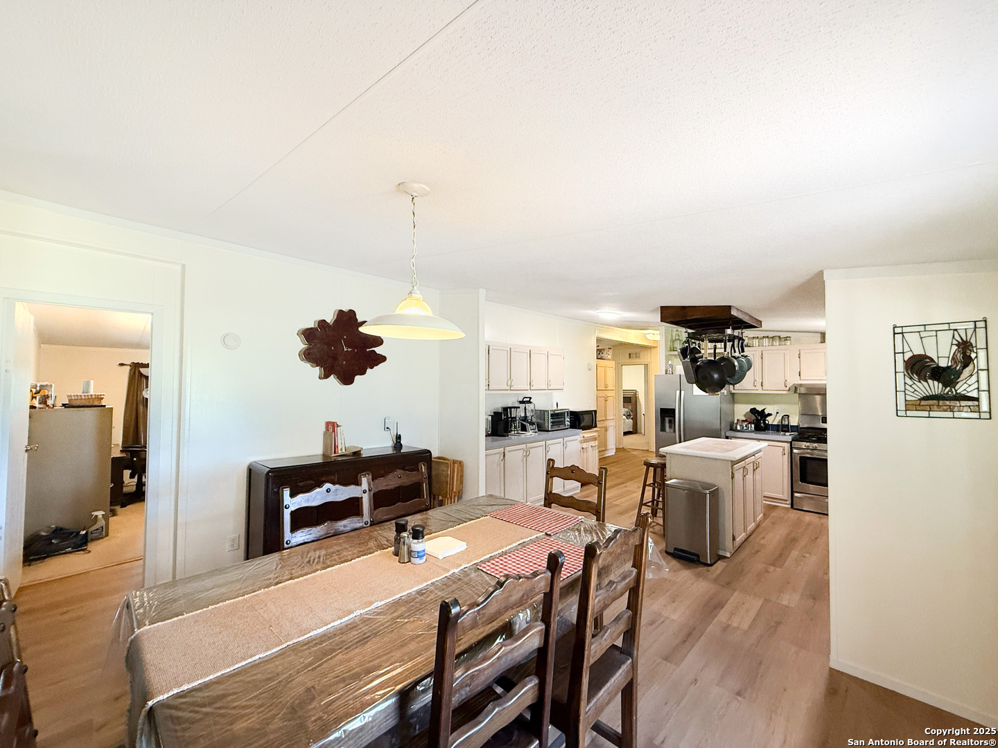 227 River Bluff Drive Lytle, TX 78052 - Photo 14 of 45 a living room with furniture and a flat screen tv