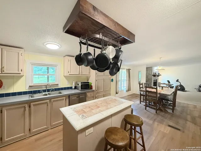 a kitchen with a table and chairs in it