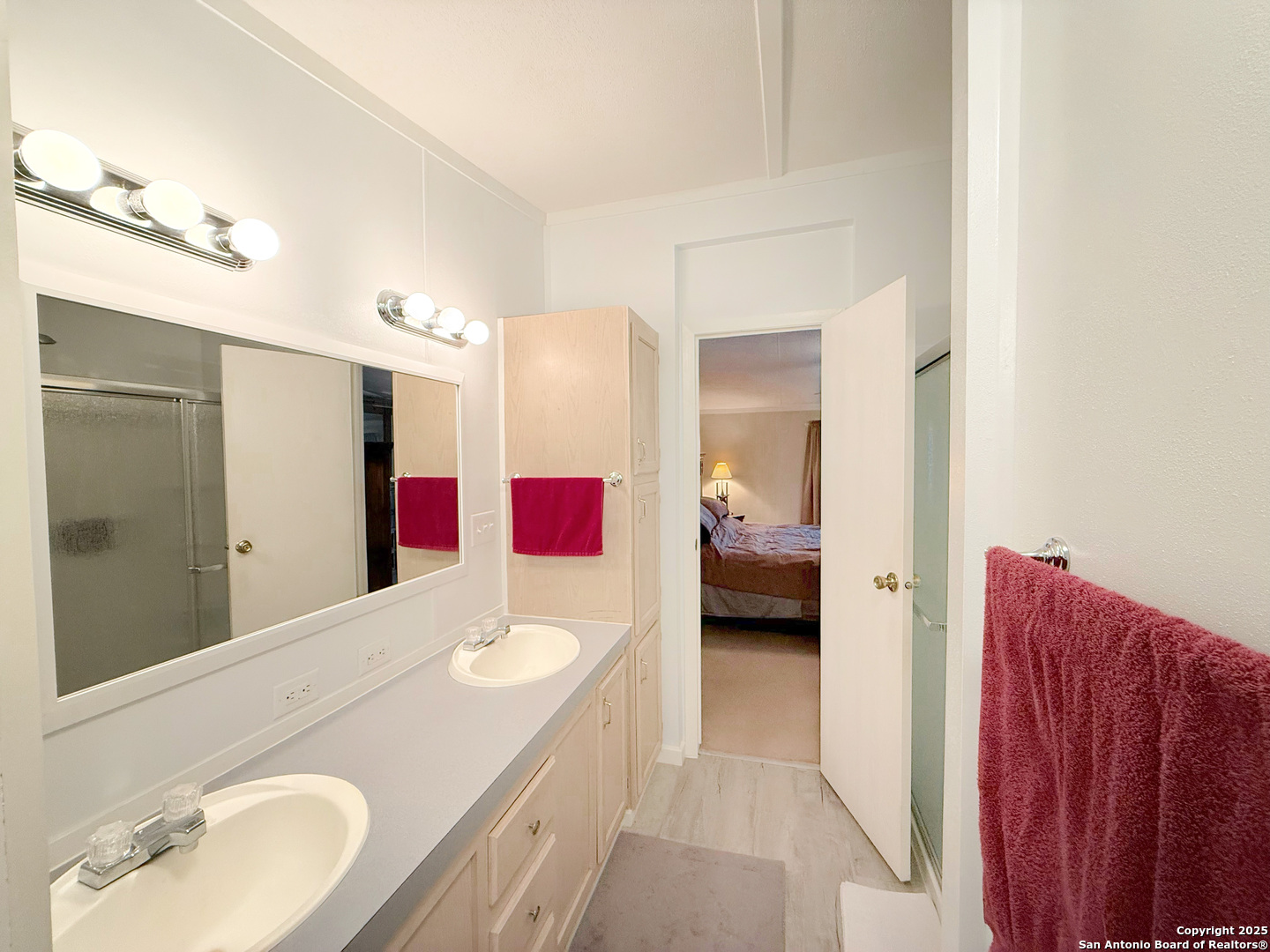 227 River Bluff Drive Lytle, TX 78052 - Photo 24 of 45 a en suite bathroom with a sink vanity and a mirror