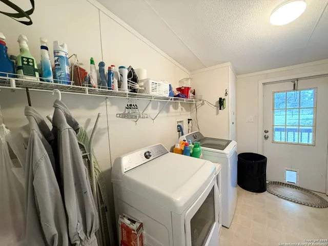 a kitchen with stainless steel appliances a sink and a refrigerator