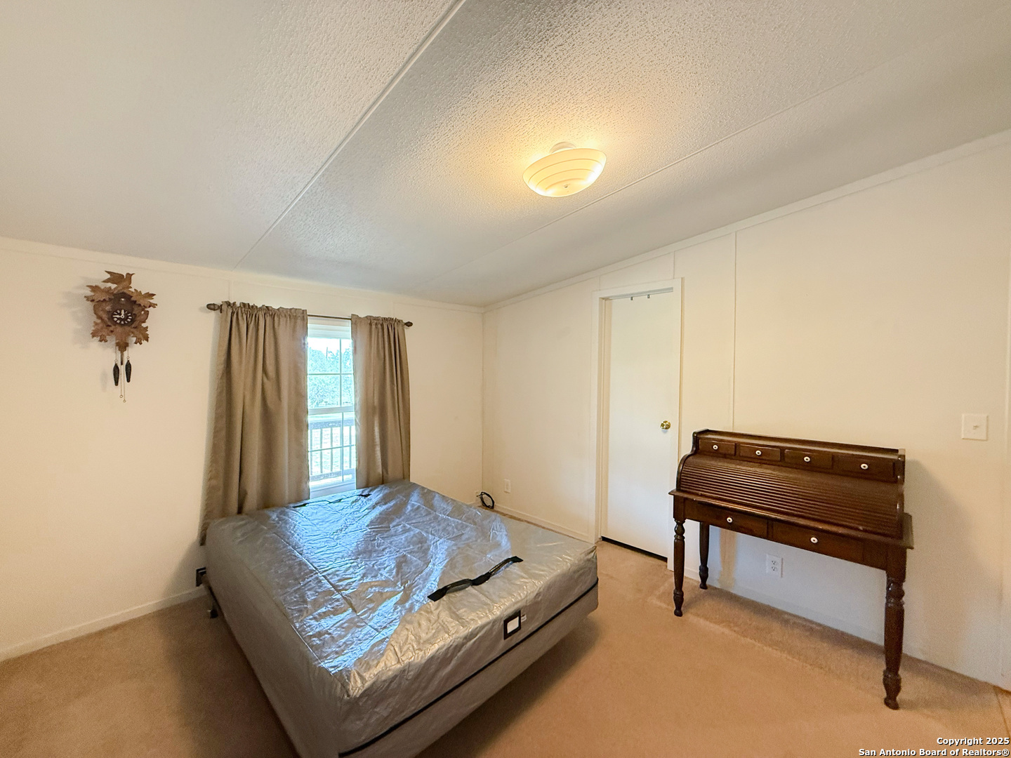227 River Bluff Drive Lytle, TX 78052 - Photo 29 of 45 a living room with furniture and a piano