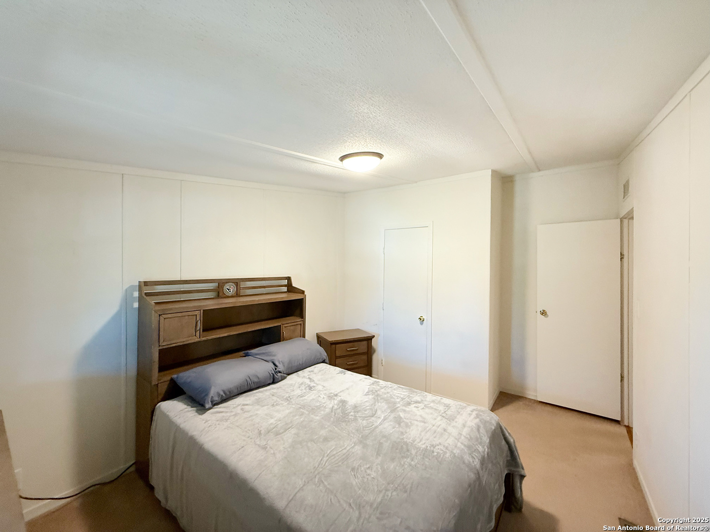 227 River Bluff Drive Lytle, TX 78052 - Photo 31 of 45 a bedroom with a bed and a window