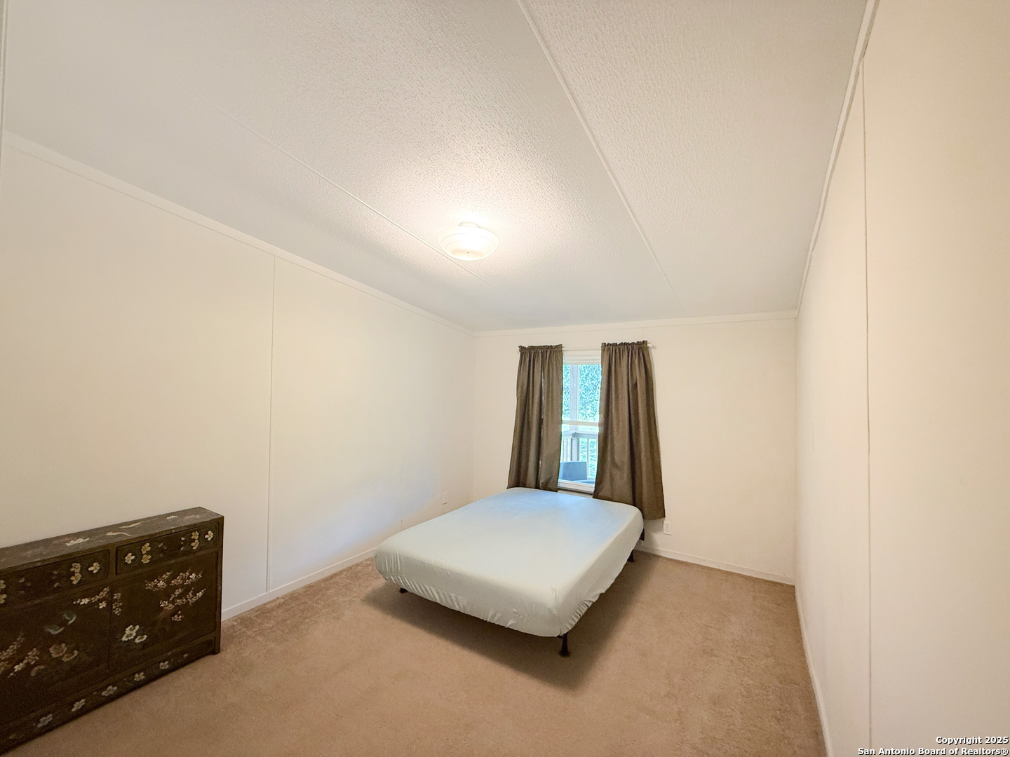 227 River Bluff Drive Lytle, TX 78052 - Photo 33 of 45 an empty room with a window