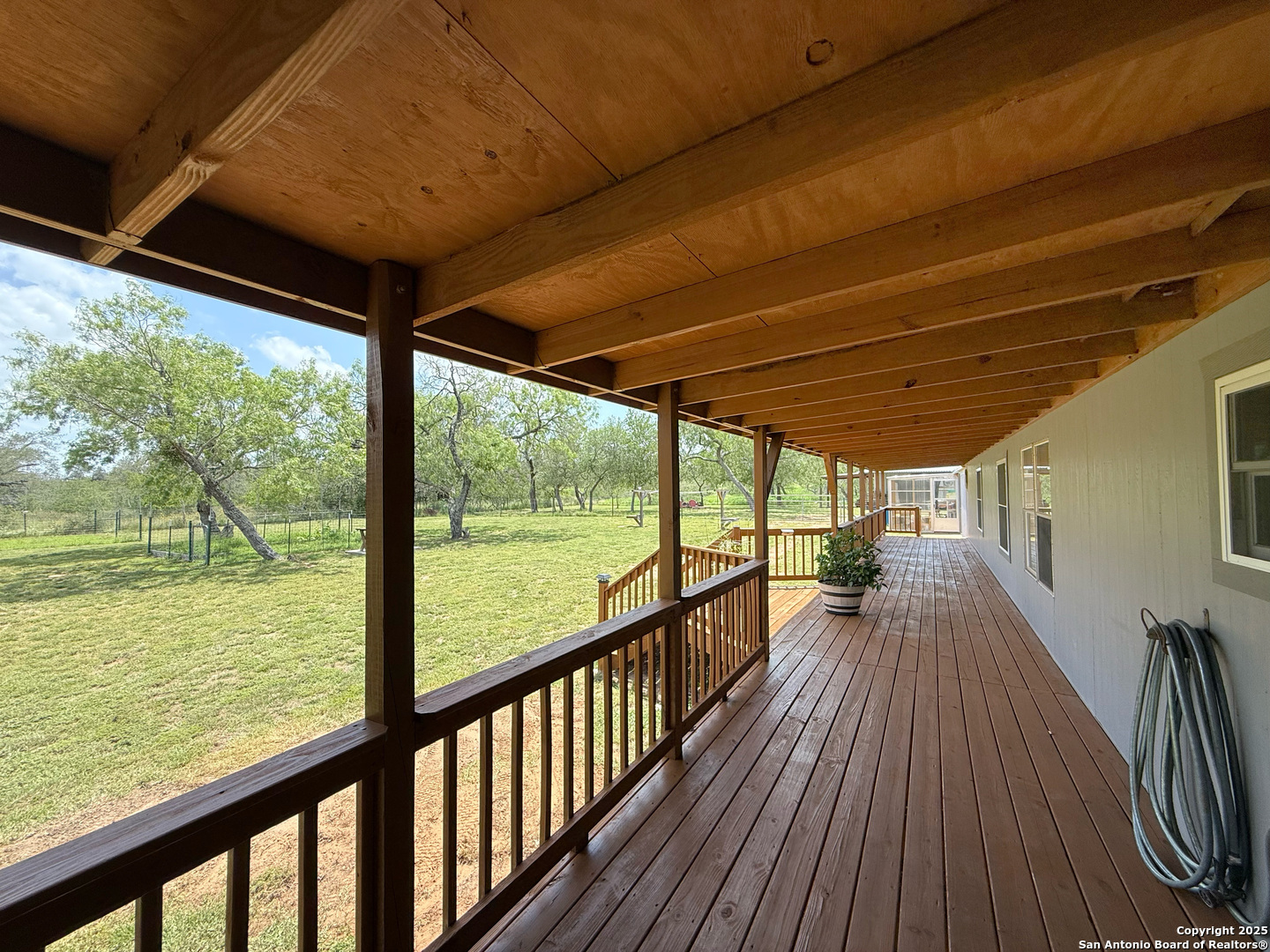 227 River Bluff Drive Lytle, TX 78052 - Photo 37 of 45 a view of a balcony with wooden floor