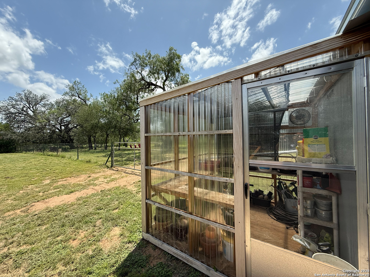 227 River Bluff Drive Lytle, TX 78052 - Photo 39 of 45 a view of a swimming pool with a patio and a yard