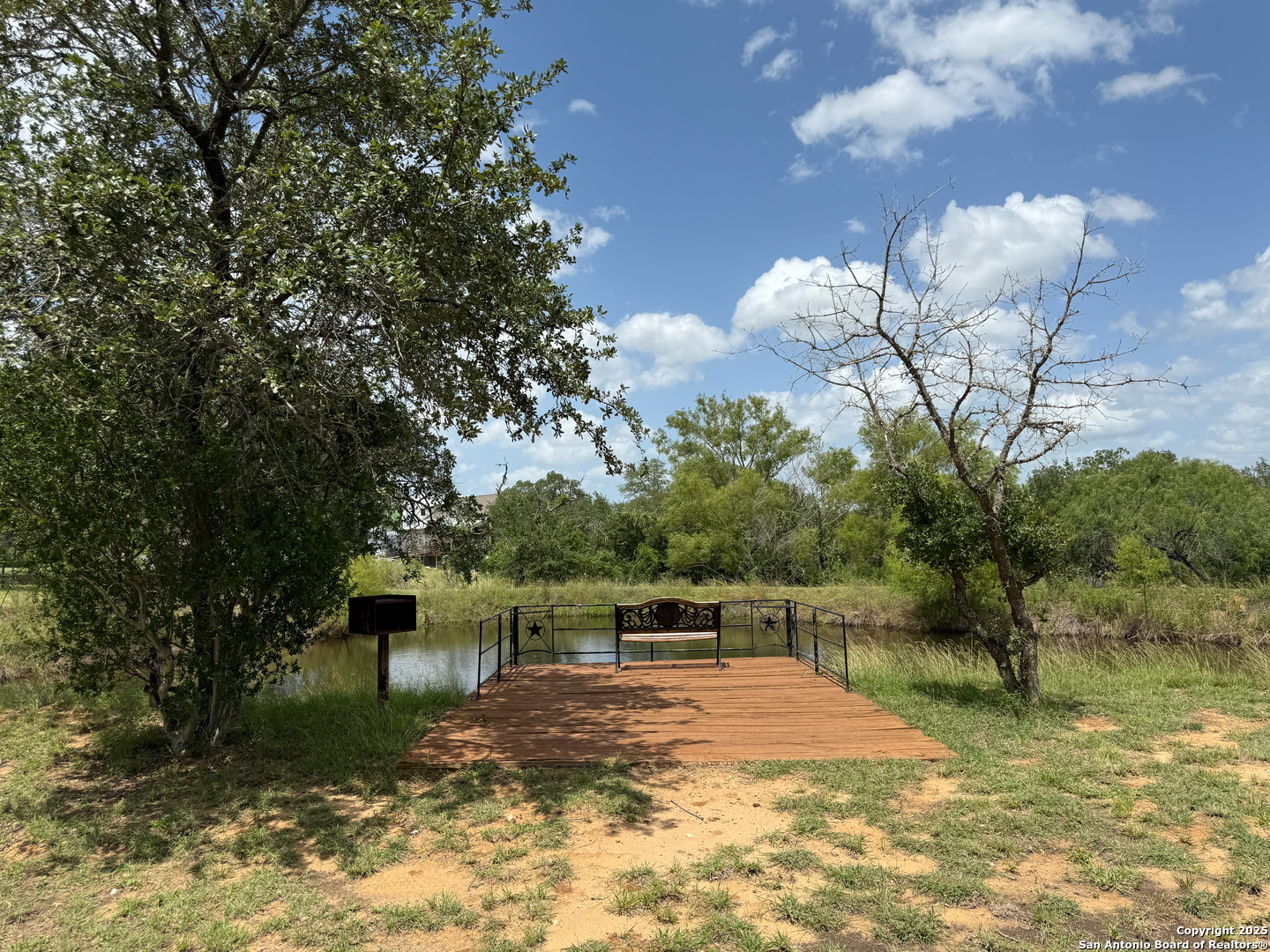227 River Bluff Drive Lytle, TX 78052 - Photo 4 of 45 a front view of a house with a yard and a large tree
