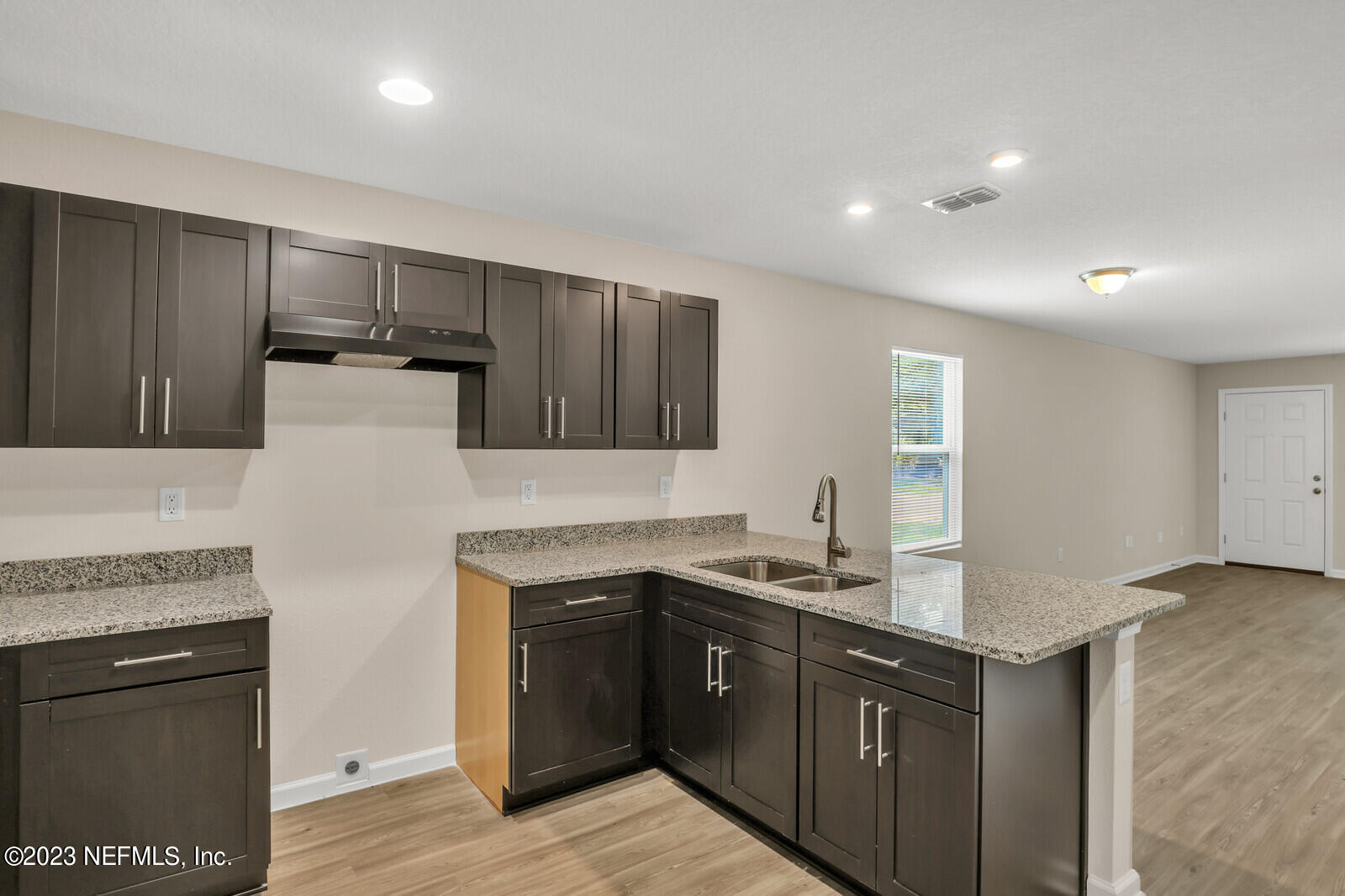 1705 Wright Avenue Jacksonville, FL 32207 - Photo 11 of 22 a kitchen with stainless steel appliances granite countertop a stove a sink and a refrigerator
