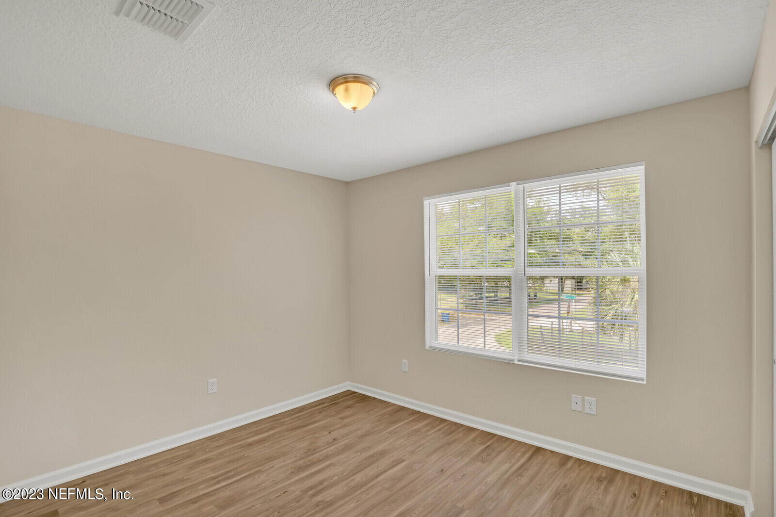 1705 Wright Avenue Jacksonville, FL 32207 - Photo 17 of 22 a view of an empty room with wooden floor and a window