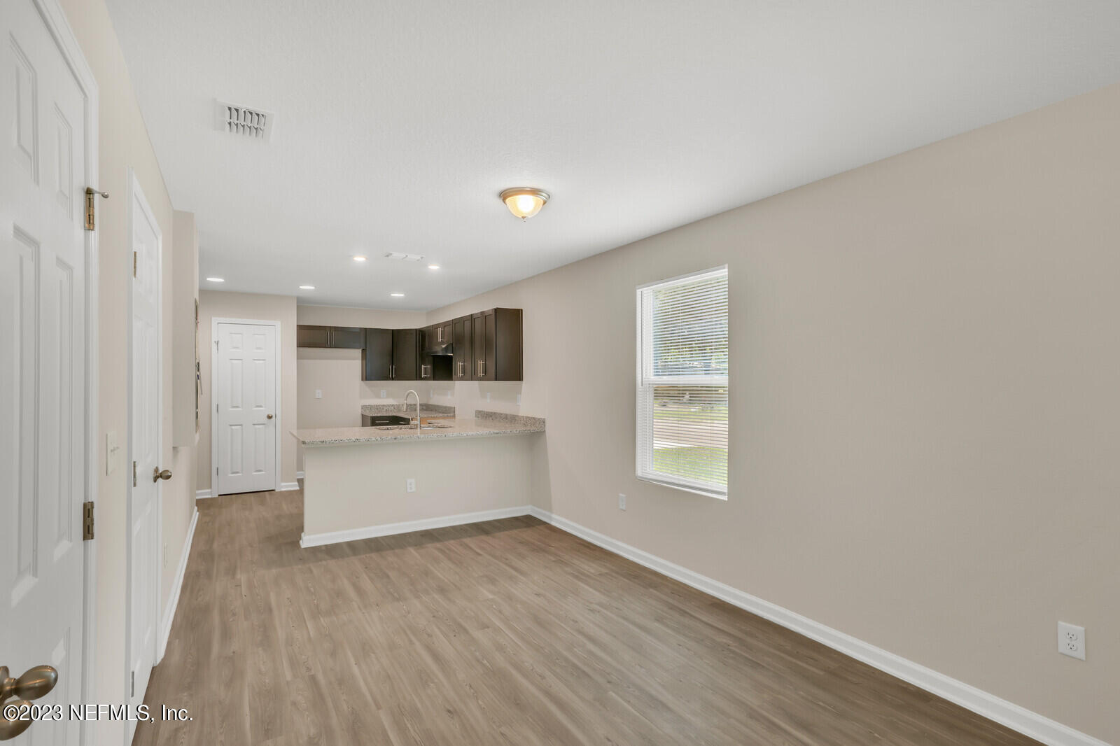 1705 Wright Avenue Jacksonville, FL 32207 - Photo 9 of 22 a view of a big room with wooden floor and windows