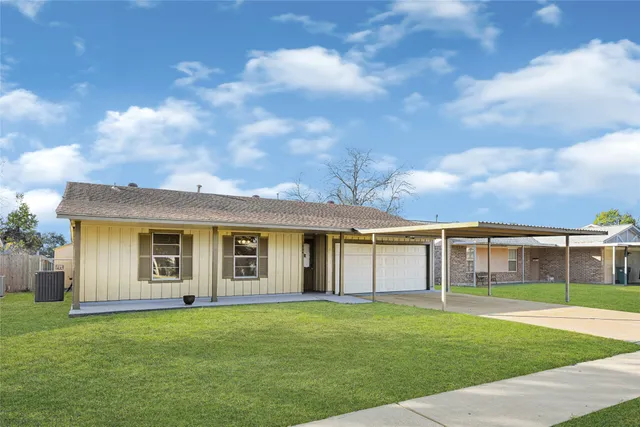 front view of a house with a garden