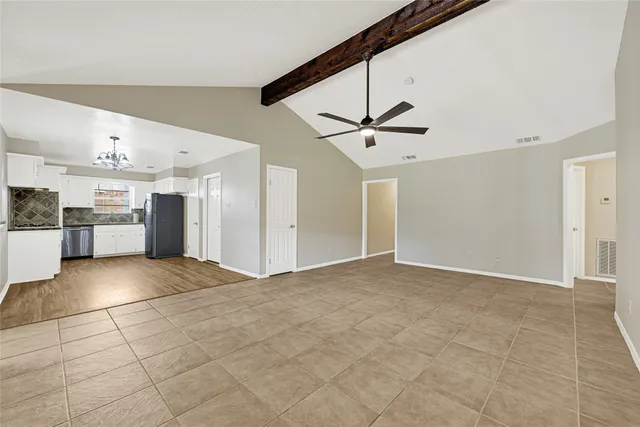 a view of kitchen with sink microwave refrigerator and stove