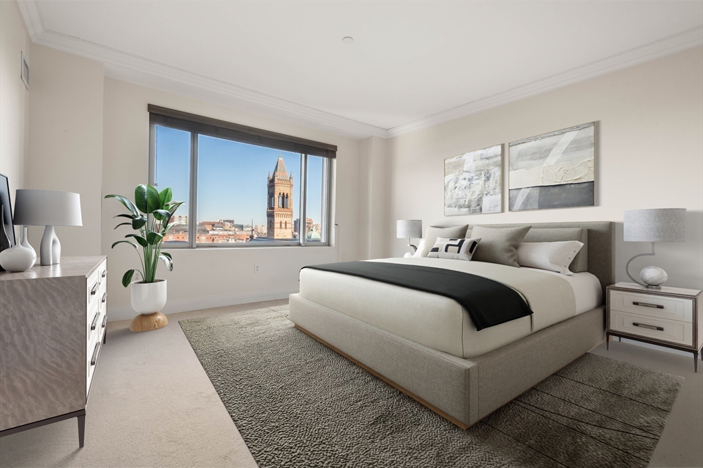 1 Huntington Avenue, Unit 904 Boston, MA 02116 - Photo 3 of 10 a bedroom with bed and a couch