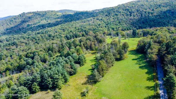 a view of a field with an outdoor space