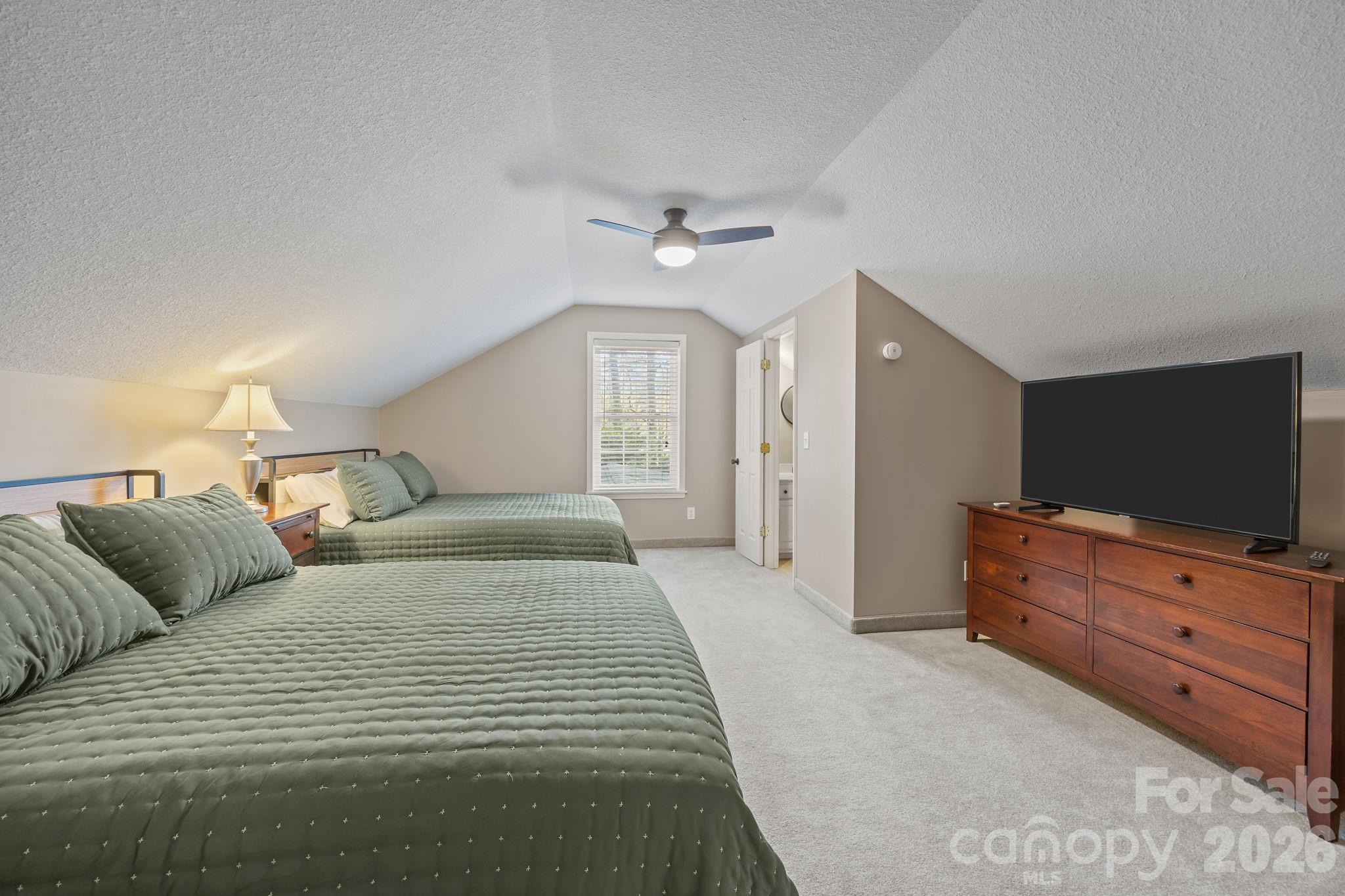 1870 Scout Road Salisbury, NC 28146 - Photo 36 of 48 a bedroom with a bed and a flat screen tv