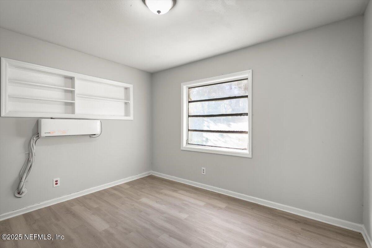 7567 Strato Road Jacksonville, FL 32210 - Photo 14 of 26 an empty room with a window
