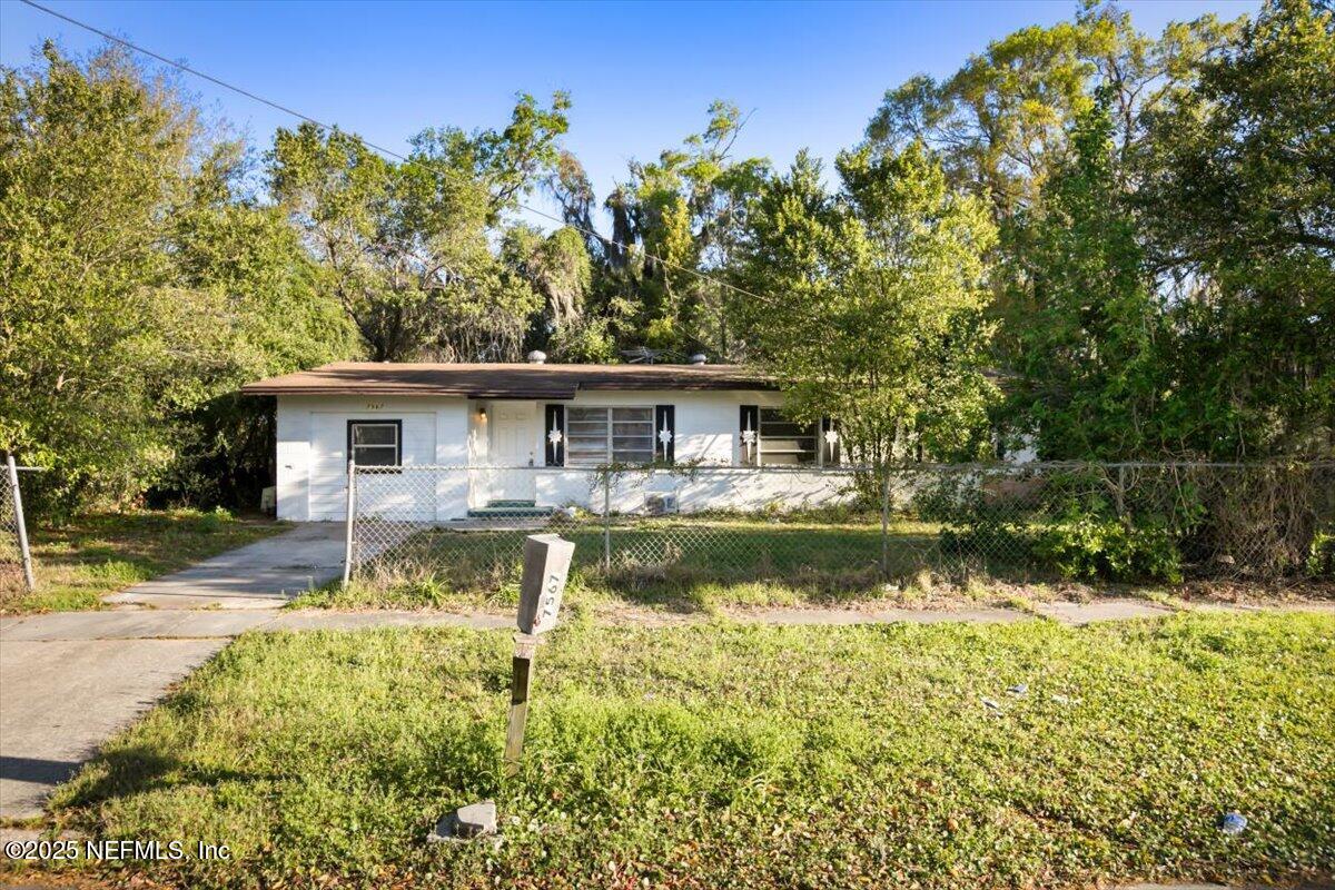 7567 Strato Road Jacksonville, FL 32210 - Photo 2 of 26 a view of a house with swimming pool and a chairs