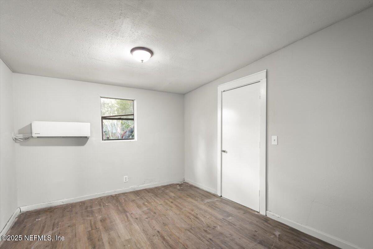 7567 Strato Road Jacksonville, FL 32210 - Photo 22 of 26 an empty room with a window
