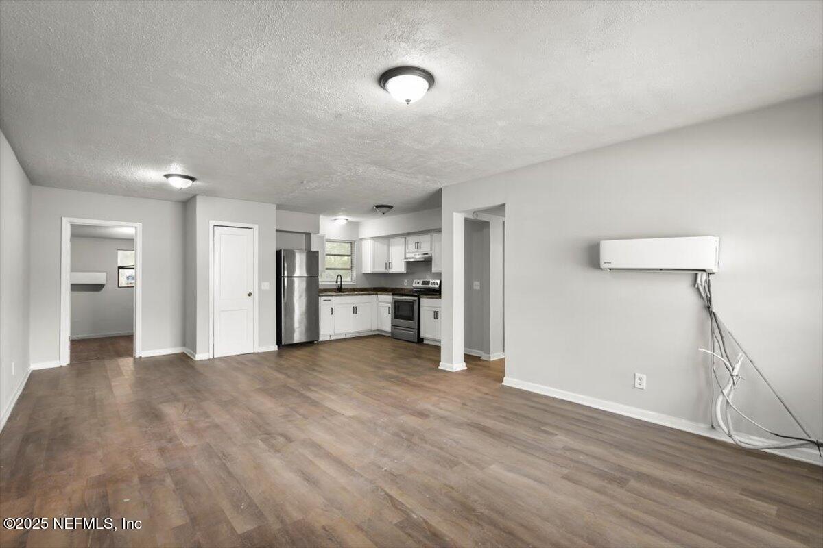 7567 Strato Road Jacksonville, FL 32210 - Photo 9 of 26 a view of a kitchen with a sink and a refrigerator