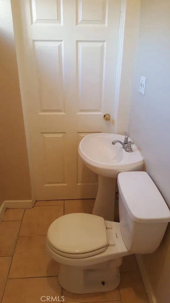 1060 Cherry Long Beach, CA 90813 - Photo 19 of 63 a white toilet sitting next to a bathroom sink