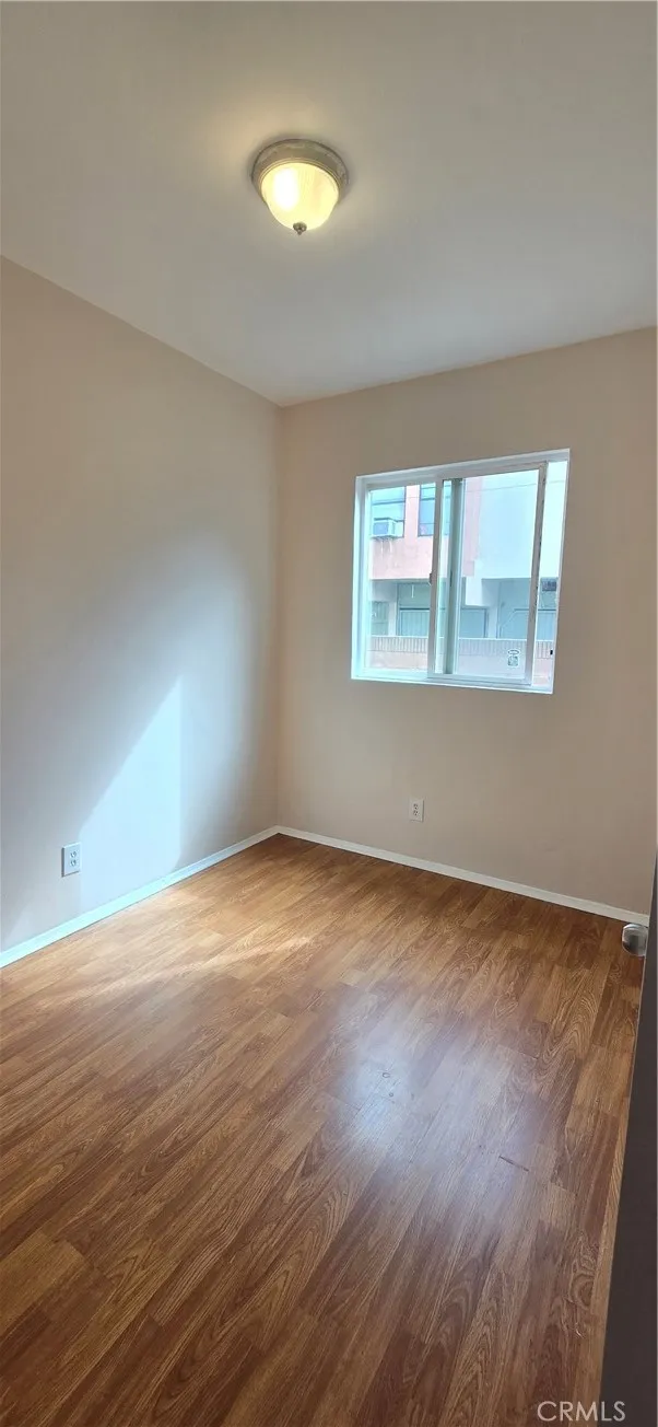 1060 Cherry Long Beach, CA 90813 - Photo 48 of 63 an empty room with wooden floor and windows