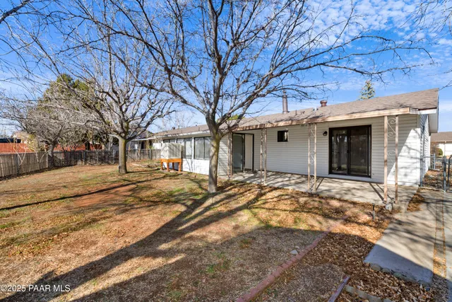a view of a house with snow on the road
